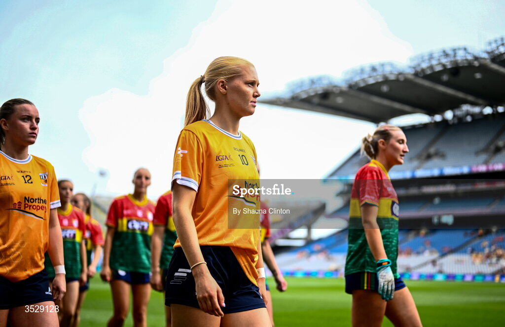 2 August 2026; Players from both teams walk in the parade ahead of the LGFA TG4 All-Ireland Junior Championship final match between Antrim and Carlow at Croke Park in Dublin. Photo by Shauna Clinton/Sportsfile