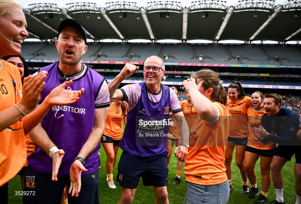 2 August 2026; Antrim manager Chris Scullion, centre, celebrates with players after their side's victory in the LGFA TG4 All-Ireland Junior Championship final match between Antrim and Carlow at Croke Park in Dublin. Photo by Shauna Clinton/Sportsfile