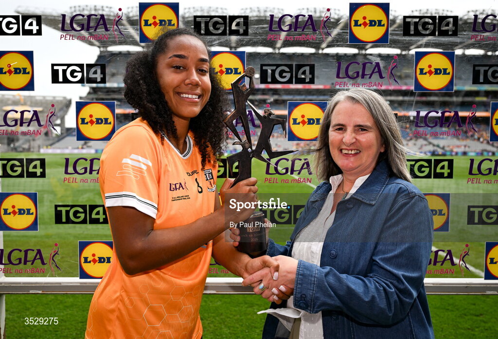 2 August 2026; Lara Dahunsi of Antrim receives the Player of the Match award from Lís Ní Dhálaigh, Director of Marketing, TG4, following the LGFA TG4 All-Ireland Junior Championship final match between Antrim and Carlow at Croke Park in Dublin. Photo by Paul Phelan/Sportsfile