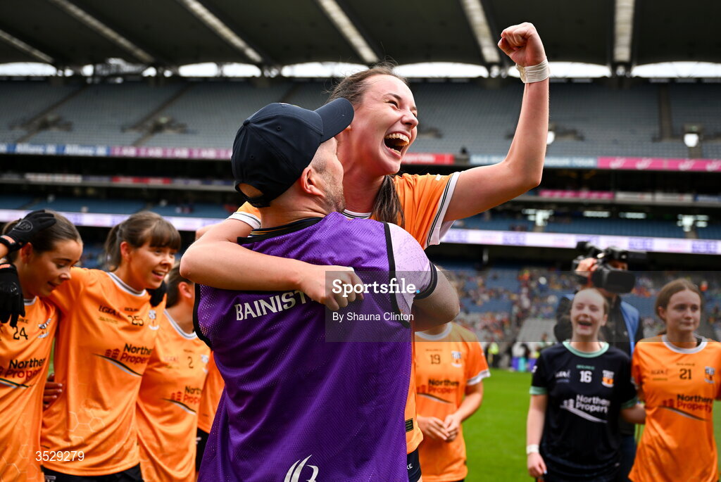 2 August 2026; Antrim manager Chris Scullion, left, and Hanna Donaghy of Antrim celebrate after their side's victory in the LGFA TG4 All-Ireland Junior Championship final match between Antrim and Carlow at Croke Park in Dublin. Photo by Shauna Clinton/Sportsfile