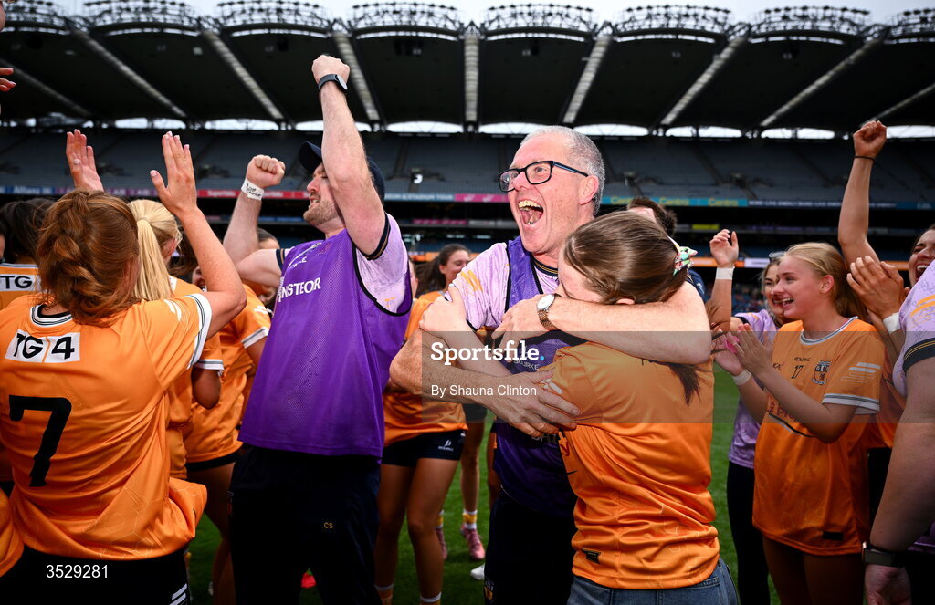 2 August 2026; Antrim manager Chris Scullion, centre, and players celebrate after their side's victory in the LGFA TG4 All-Ireland Junior Championship final match between Antrim and Carlow at Croke Park in Dublin. Photo by Shauna Clinton/Sportsfile