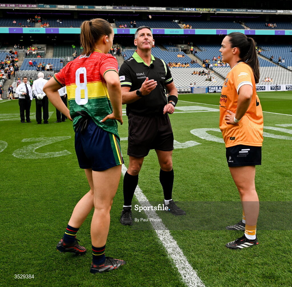 2 August 2026; Referee Conor McCarthy, centre, is joined by Carlow captain Róisín Bailey. left and Antrim captain Bronagh Devlin for the coin toss before the LGFA TG4 All-Ireland Junior Championship final match between Antrim and Carlow at Croke Park in Dublin. Photo by Paul Phelan/Sportsfile