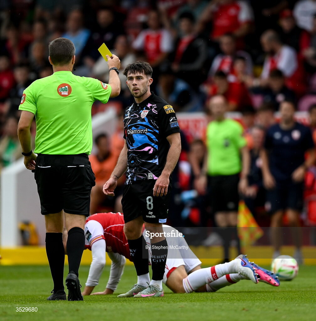 2 August 2026; Adam O'Reilly of Derry City is shown a yellow card by referee Rob Harvey during the SSE Airtricity Men's Premier Division match between St Patrick's Athletic and Derry City at Richmond Park in Dublin. Photo by Stephen McCarthy/Sportsfile
