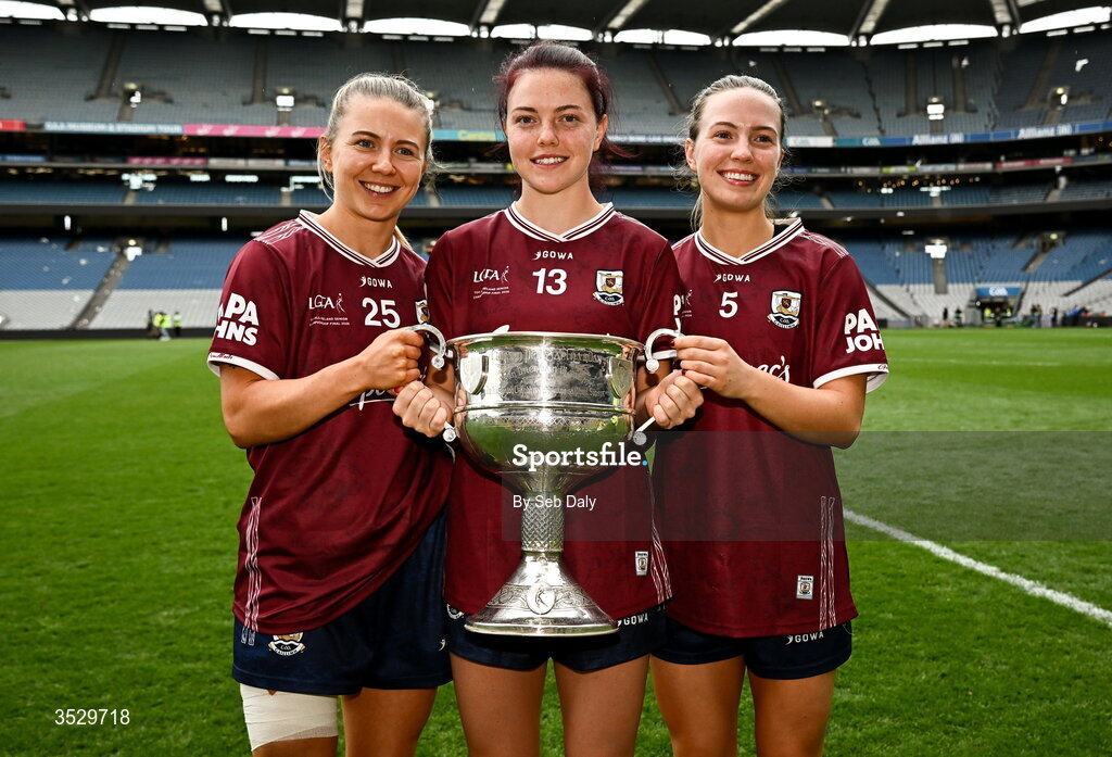2 August 2026; Galway players, from left, Lynsey Noone, Eva Noone, and Hannah Noone with the Brendan Martin Cup after the LGFA TG4 All-Ireland Senior Championship final match between Galway and Kerry at Croke Park in Dublin. Photo by Seb Daly/Sportsfile