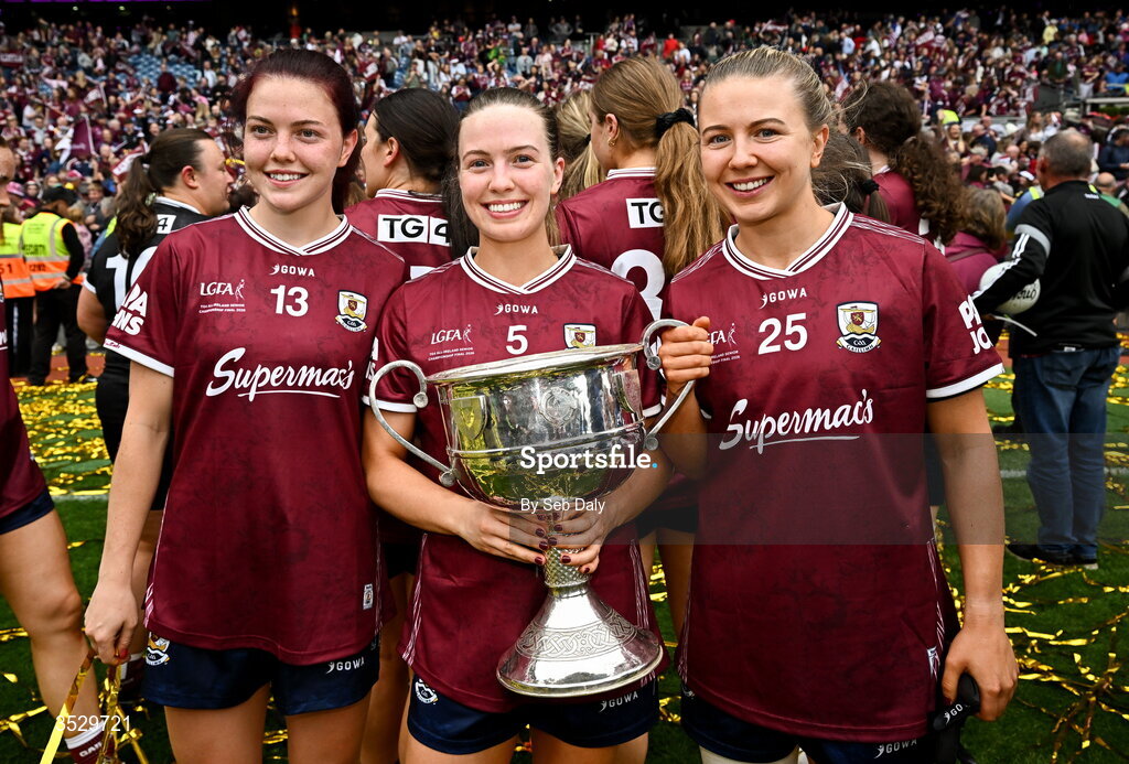 2 August 2026; Galway players, from left, Eva Noone, Hannah Noone, and Lynsey Noone with the Brendan Martin Cup after the LGFA TG4 All-Ireland Senior Championship final match between Galway and Kerry at Croke Park in Dublin. Photo by Seb Daly/Sportsfile