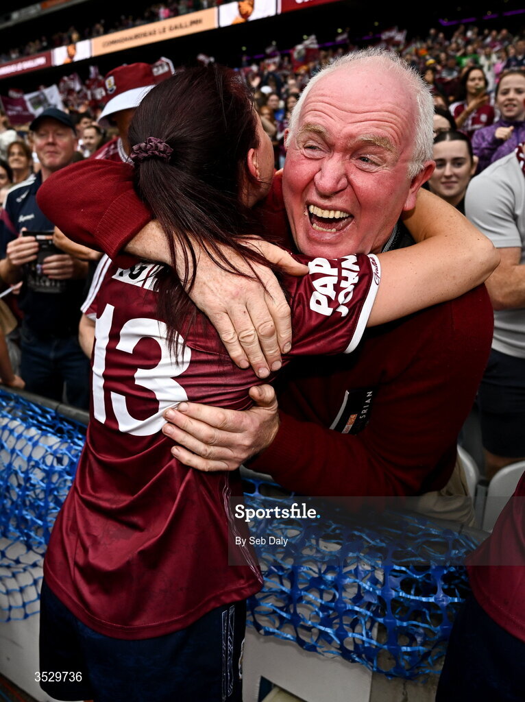 2 August 2026; Eva Noone of Galway celebrates with Willie Ward, father of teammates Nicole and Louise Ward, after the LGFA TG4 All-Ireland Senior Championship final match between Galway and Kerry at Croke Park in Dublin. Photo by Seb Daly/Sportsfile