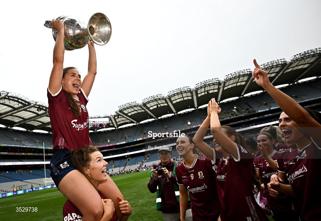 2 August 2026; Galway captain Kate Geraghty celebrates with the Brendan Martin Cup, on the shoulders of teammate Aoife Ní Ruairc, after her side's victory in the LGFA TG4 All-Ireland Senior Championship final match between Galway and Kerry at Croke Park in Dublin. Photo by Seb Daly/Sportsfile