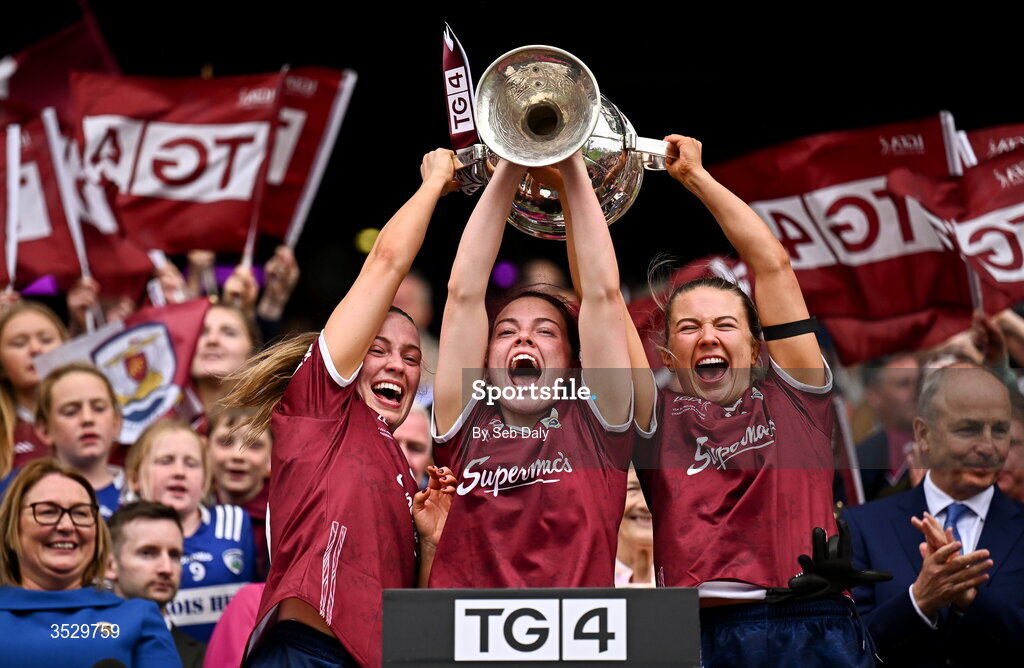 2 August 2026; Galway players, from left, Hannah Noone, Eva Noone, and Lynsey Noone lift the Brendan Martin Cup after their side's victory in the LGFA TG4 All-Ireland Senior Championship final match between Galway and Kerry at Croke Park in Dublin. Photo by Seb Daly/Sportsfile