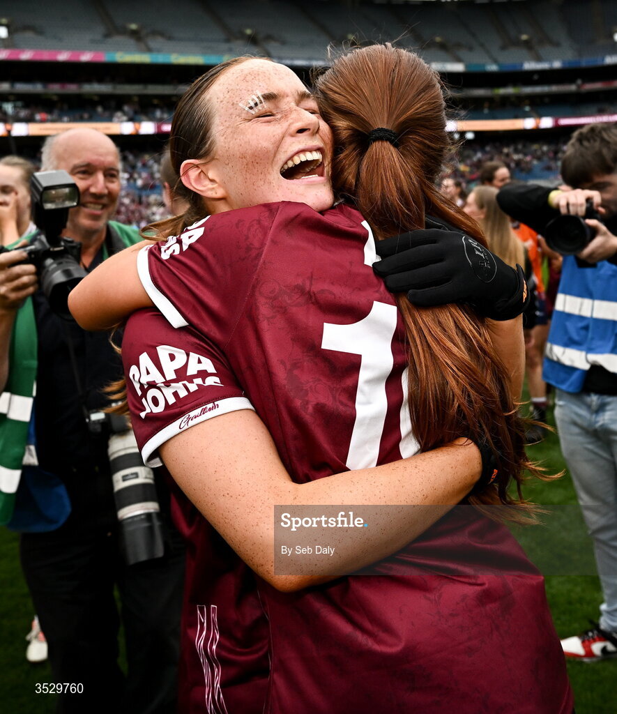 2 August 2026; Galway players, from left, Niamh Divilly, left, and Olivia Divilly celebrate after their side's victory in the LGFA TG4 All-Ireland Senior Championship final match between Galway and Kerry at Croke Park in Dublin. Photo by Seb Daly/Sportsfile