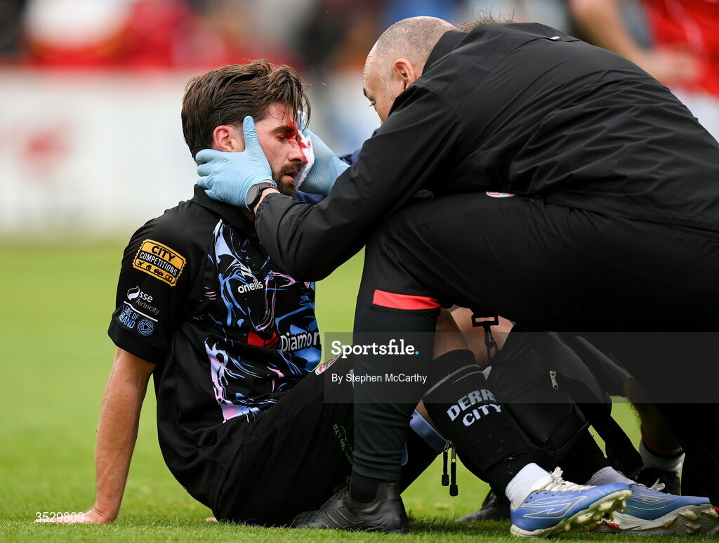 2 August 2026; (EDITORS NOTE: Image contains graphic content) Brandon Fleming of Derry City receives medical attention from physiotherapist Colum O'Neill after picking up a head injury during the SSE Airtricity Men's Premier Division match between St Patrick's Athletic and Derry City at Richmond Park in Dublin. Photo by Stephen McCarthy/Sportsfile
