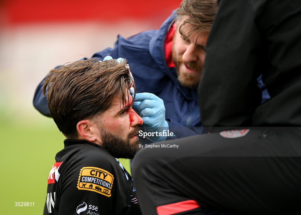 2 August 2026; (EDITORS NOTE: Image contains graphic content) Brandon Fleming of Derry City receives medical attention after picking up a head injury during the SSE Airtricity Men's Premier Division match between St Patrick's Athletic and Derry City at Richmond Park in Dublin. Photo by Stephen McCarthy/Sportsfile