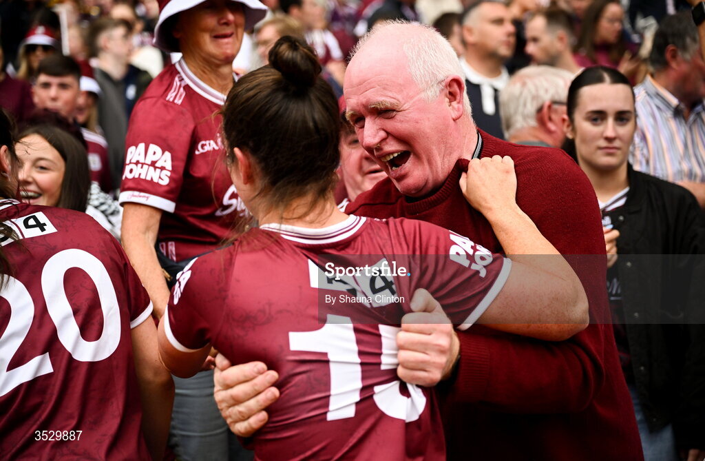 2 August 2026; Róisín Leonard of Galway celebrates with Willie Ward, father of teammates Nicole and Louise Ward, after the LGFA TG4 All-Ireland Senior Championship final match between Galway and Kerry at Croke Park in Dublin. Photo by Shauna Clinton/Sportsfile