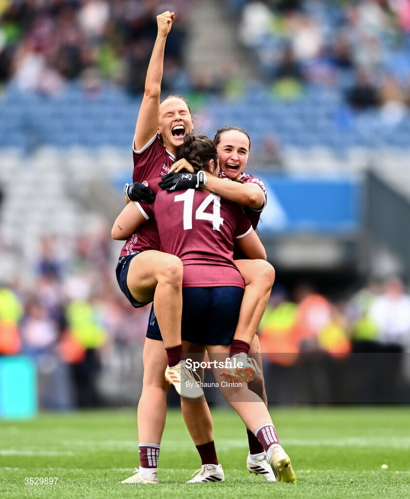 2 August 2026; Galway players, from left, Olivia Divilly, Leanne Coen and Andrea Trill celebrate at the final whistle of the LGFA TG4 All-Ireland Senior Championship final match between Galway and Kerry at Croke Park in Dublin. Photo by Shauna Clinton/Sportsfile