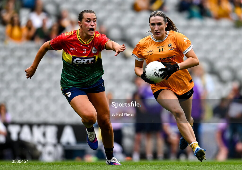 2 August 2026; Maria O'Neill of Antrim in action against Anne Roche of Carlow during the LGFA TG4 All-Ireland Junior Championship final match between Antrim and Carlow at Croke Park in Dublin. Photo by Paul Phelan/Sportsfile