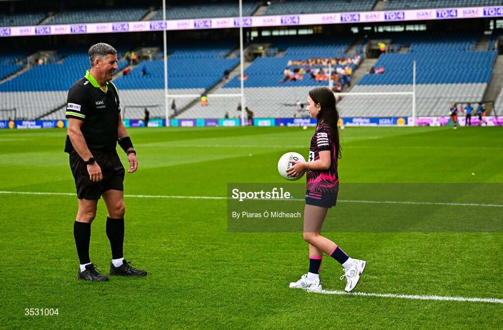 2 August 2026; Harper Kirwan of Éire Óg GAA in Carlow brings out the match ball to referee Conor McCarthy before the LGFA TG4 All-Ireland Junior Championship final match between Antrim and Carlow at Croke Park in Dublin. Photo by Piaras Ó Mídheach/Sportsfile