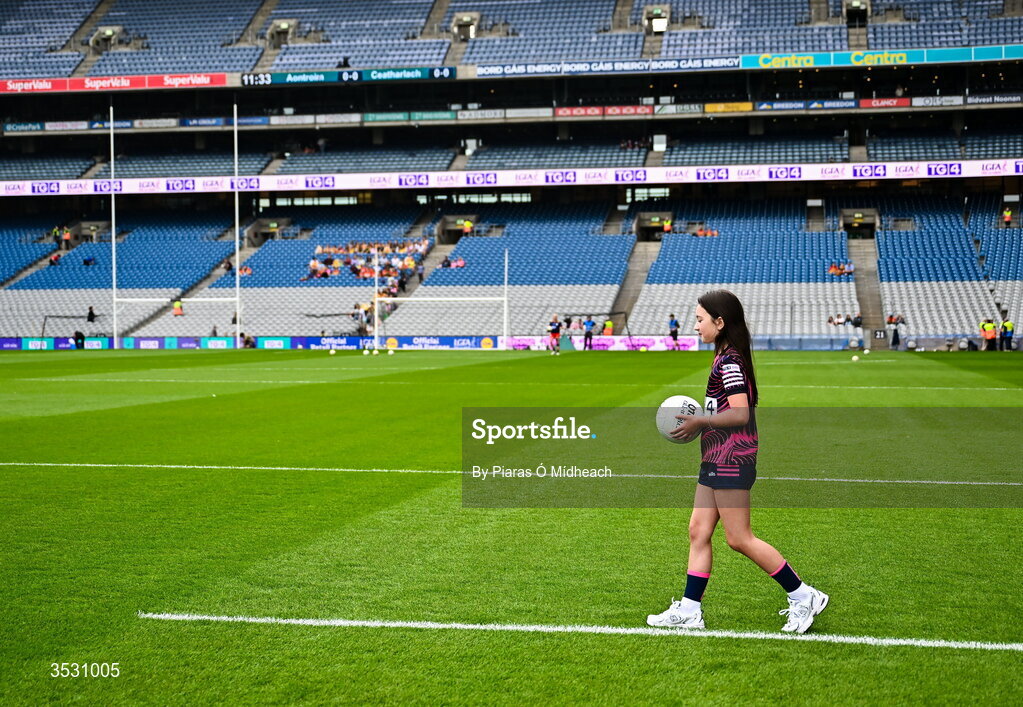 2 August 2026; Harper Kirwan of Éire Óg GAA in Carlow brings out the match ball to referee Conor McCarthy before the LGFA TG4 All-Ireland Junior Championship final match between Antrim and Carlow at Croke Park in Dublin. Photo by Piaras Ó Mídheach/Sportsfile