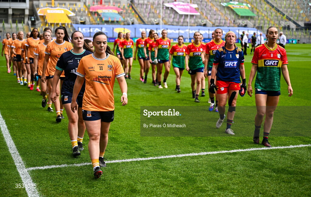 2 August 2026; Antrim captain Bronagh Devlin and Carlow captain Róisín Bailey lead their team-mates in the parade before the LGFA TG4 All-Ireland Junior Championship final match between Antrim and Carlow at Croke Park in Dublin. Photo by Piaras Ó Mídheach/Sportsfile