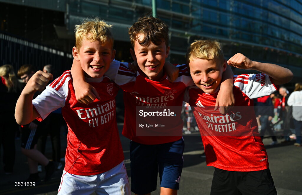 5 August 2026; Arsenal supporters Harry Boland, Michael Ryan and Luke Short before the pre-season friendly match between Arsenal and Real Betis at the Aviva Stadium in Dublin. Photo by Tyler Miller/Sportsfile