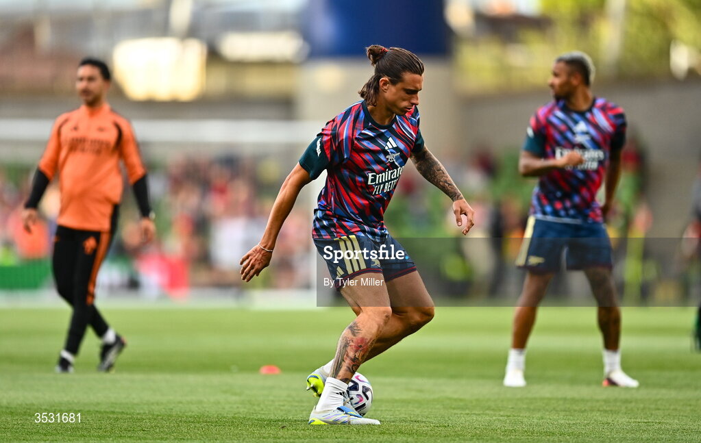 5 August 2026; Riccardo Calafiori of Arsenal warms up before the pre-season friendly match between Arsenal and Real Betis at the Aviva Stadium in Dublin. Photo by Tyler Miller/Sportsfile