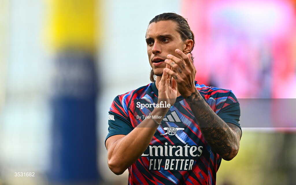 5 August 2026; Riccardo Calafiori of Arsenal warms up before the pre-season friendly match between Arsenal and Real Betis at the Aviva Stadium in Dublin. Photo by Tyler Miller/Sportsfile