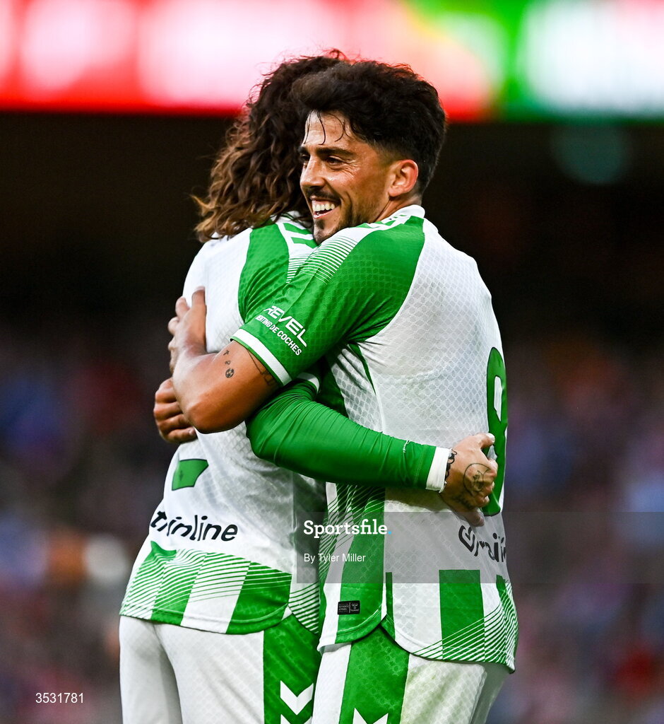 5 August 2026; Pablo Fornals of Real Betis celebrates with Héctor Bellerín after scoring his side's third goal  during the pre-season friendly match between Arsenal and Real Betis at the Aviva Stadium in Dublin. Photo by Tyler Miller/Sportsfile