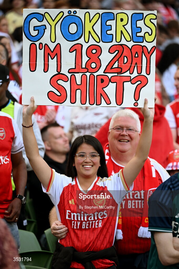 5 August 2026; An Arsenal supporter holds a sign titled 'Gyokeres I'm 18 2Day Shirt?' during the pre-season friendly match between Arsenal and Real Betis at the Aviva Stadium in Dublin. Photo by Stephen McCarthy/Sportsfile