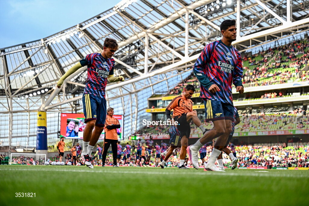 5 August 2026; Max Dowman of Arsenal, right and Piero Hincapié warm up before the pre-season friendly match between Arsenal and Real Betis at the Aviva Stadium in Dublin. Photo by Tyler Miller/Sportsfile