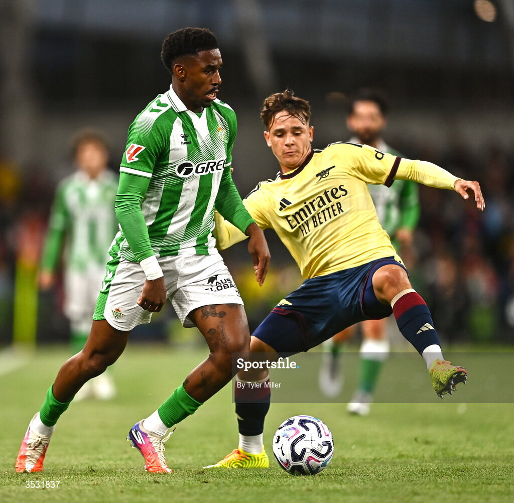 5 August 2026; Junior Firpo of Real Betis in action against Theo Julienne of Arsenal during the pre-season friendly match between Arsenal and Real Betis at the Aviva Stadium in Dublin. Photo by Tyler Miller/Sportsfile