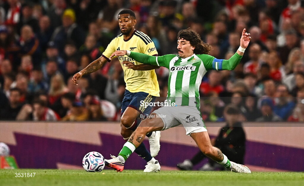 5 August 2026; Reiss Nelson of Arsenal in action against Héctor Bellerín of Real Betis  during the pre-season friendly match between Arsenal and Real Betis at the Aviva Stadium in Dublin. Photo by Tyler Miller/Sportsfile