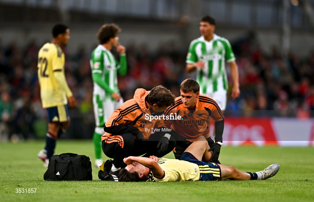 5 August 2026; Louie Copley of Arsenal receives medical attention during the pre-season friendly match between Arsenal and Real Betis at the Aviva Stadium in Dublin. Photo by Tyler Miller/Sportsfile