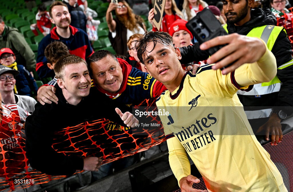 5 August 2026; Theo Julienne of Arsenal takes a selfie with supporters after the pre-season friendly match between Arsenal and Real Betis at the Aviva Stadium in Dublin. Photo by Tyler Miller/Sportsfile