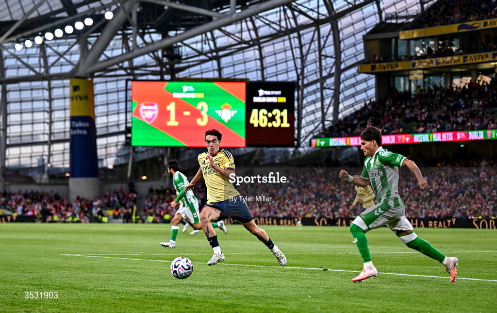 5 August 2026; Louie Copley of Arsenal, left in action against  Fran García of Real Betis during the pre-season friendly match between Arsenal and Real Betis at the Aviva Stadium in Dublin. Photo by Tyler Miller/Sportsfile