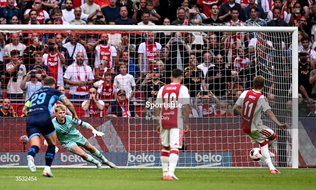 6 August 2026; Mika Godts of Ajax shoots to score his side's first goal, from a penalty, during the UEFA Conference League Third Qualifying Round first leg match between Ajax and Shelbourne at Johan Cruyff Arena in Amsterdam, Netherlands. Photo by Seb Daly/Sportsfile