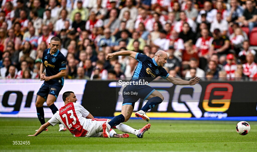 6 August 2026; Kerr McInroy of Shelbourne is tackled by Steven Berghuis of Ajax during the UEFA Conference League Third Qualifying Round first leg match between Ajax and Shelbourne at Johan Cruyff Arena in Amsterdam, Netherlands. Photo by Seb Daly/Sportsfile