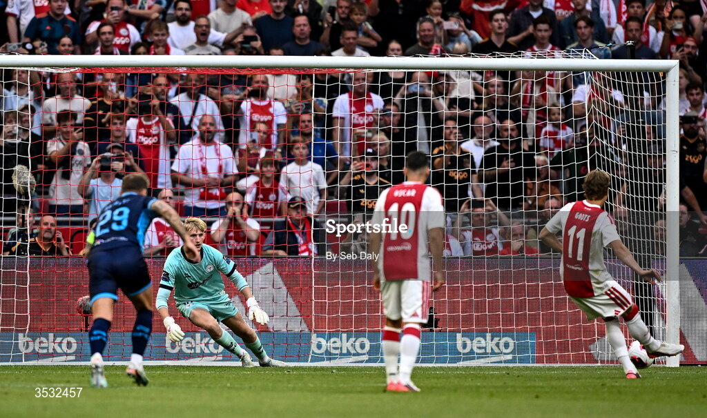 6 August 2026; Mika Godts of Ajax shoots to score his side's first goal, from a penalty, during the UEFA Conference League Third Qualifying Round first leg match between Ajax and Shelbourne at Johan Cruyff Arena in Amsterdam, Netherlands. Photo by Seb Daly/Sportsfile