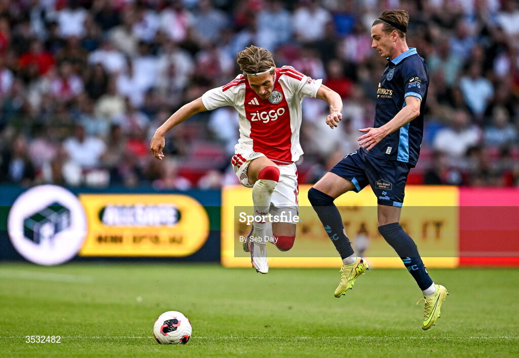 6 August 2026; Mika Godts of Ajax in action against Daniel Kelly of Shelbourne during the UEFA Conference League Third Qualifying Round first leg match between Ajax and Shelbourne at Johan Cruyff Arena in Amsterdam, Netherlands. Photo by Seb Daly/Sportsfile