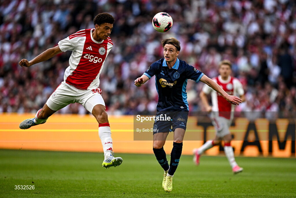 6 August 2026; Daniel Kelly of Shelbourne in action against Aaron Bouwman of Ajax during the UEFA Conference League Third Qualifying Round first leg match between Ajax and Shelbourne at Johan Cruyff Arena in Amsterdam, Netherlands. Photo by Seb Daly/Sportsfile