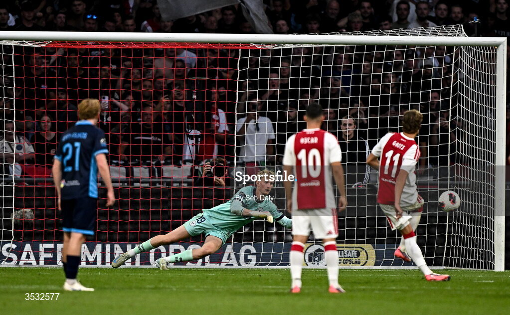 6 August 2026; Shelbourne goalkeeper Eddie Beach saves a penalty from Mika Godts of Ajax during the UEFA Conference League Third Qualifying Round first leg match between Ajax and Shelbourne at Johan Cruyff Arena in Amsterdam, Netherlands. Photo by Seb Daly/Sportsfile