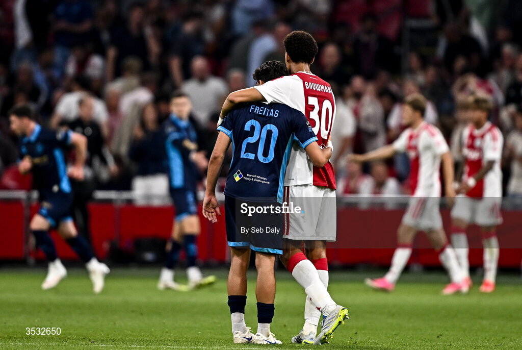 6 August 2026; Rodrigo Freitas of Shelbourne and Aaron Bouwman of Ajax embrace after the UEFA Conference League Third Qualifying Round first leg match between Ajax and Shelbourne at Johan Cruyff Arena in Amsterdam, Netherlands. Photo by Seb Daly/Sportsfile