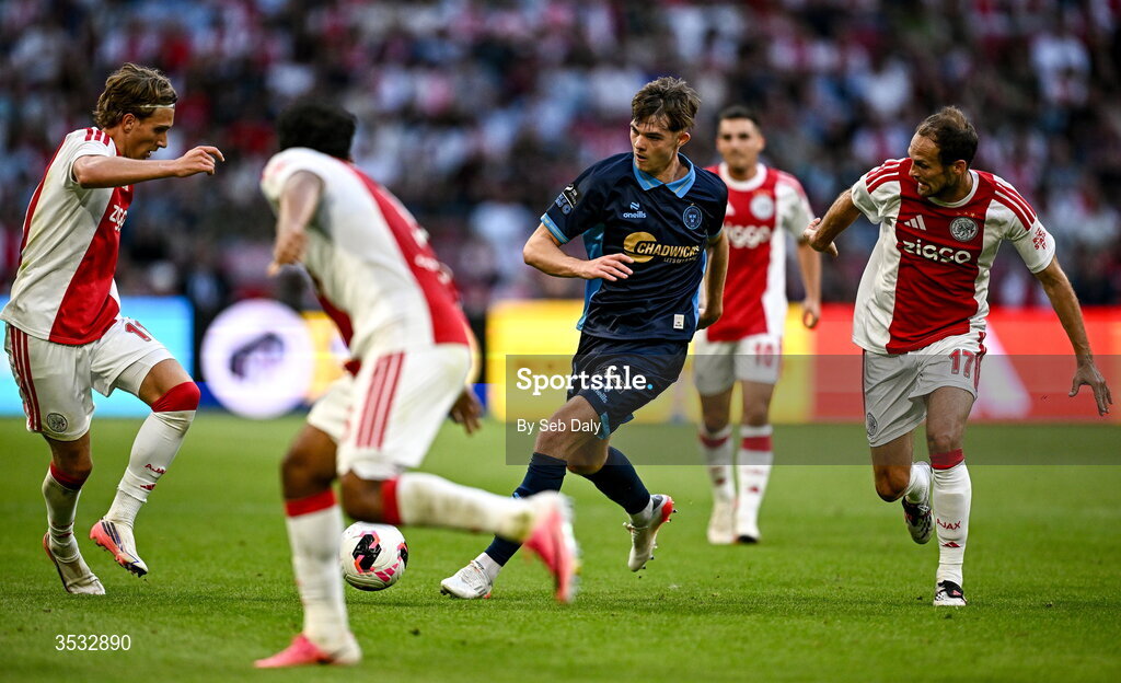 6 August 2026; Sean Moore of Shelbourne in action against Daley Blind of Ajax, right, during the UEFA Conference League Third Qualifying Round first leg match between Ajax and Shelbourne at Johan Cruyff Arena in Amsterdam, Netherlands. Photo by Seb Daly/Sportsfile