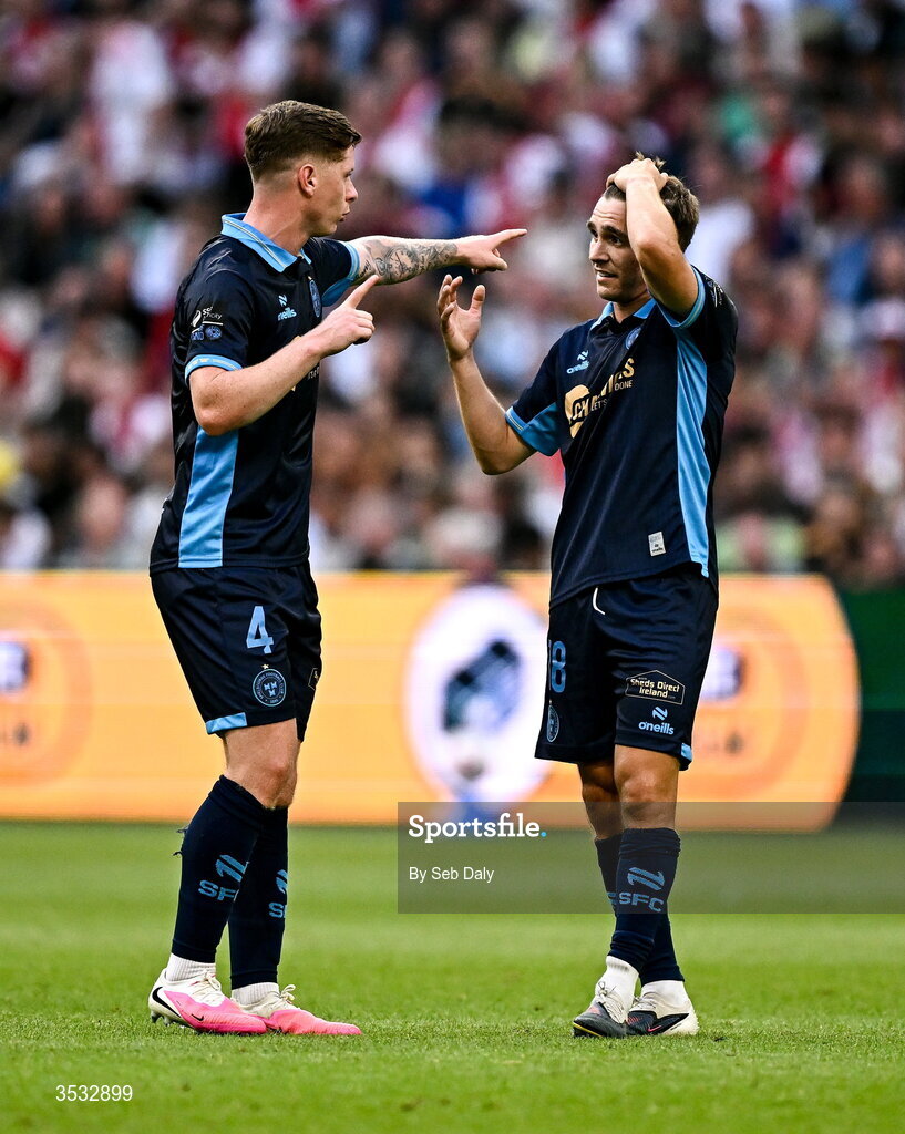 6 August 2026; Shelbourne players Kameron Ledwidge, left, and James Norris during the UEFA Conference League Third Qualifying Round first leg match between Ajax and Shelbourne at Johan Cruyff Arena in Amsterdam, Netherlands. Photo by Seb Daly/Sportsfile