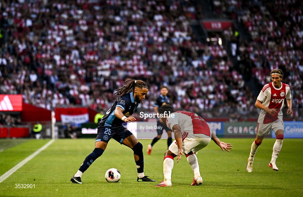 6 August 2026; Milan Mbeng of Shelbourne in action against Owen Wijndal of Ajax during the UEFA Conference League Third Qualifying Round first leg match between Ajax and Shelbourne at Johan Cruyff Arena in Amsterdam, Netherlands. Photo by Seb Daly/Sportsfile