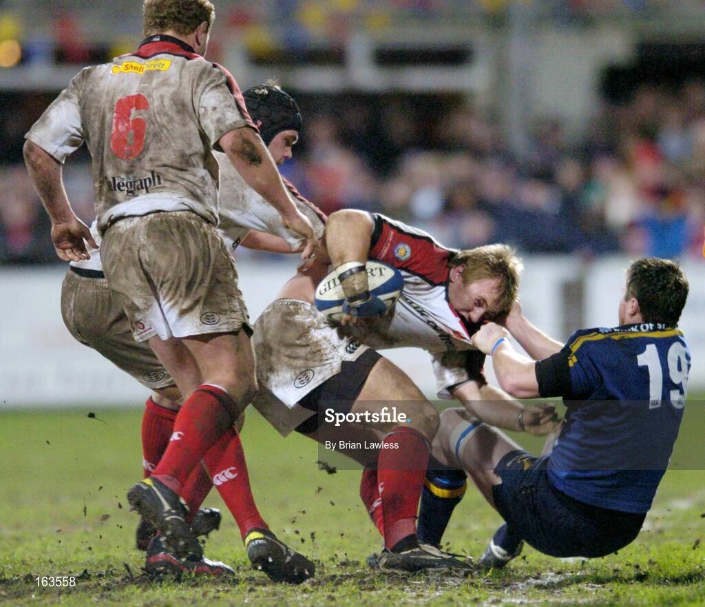 27 December 2004; Roger Wilson, supported by team-mates Campbell Feather (6) and Matt McCullough, Ulster, is tackled by Eric Miller, Leinster. Celtic League 2004-2005, Pool 1, Leinster v Ulster, Donnybrook, Dublin. Picture credit; Brian Lawless / SPORTSFILE