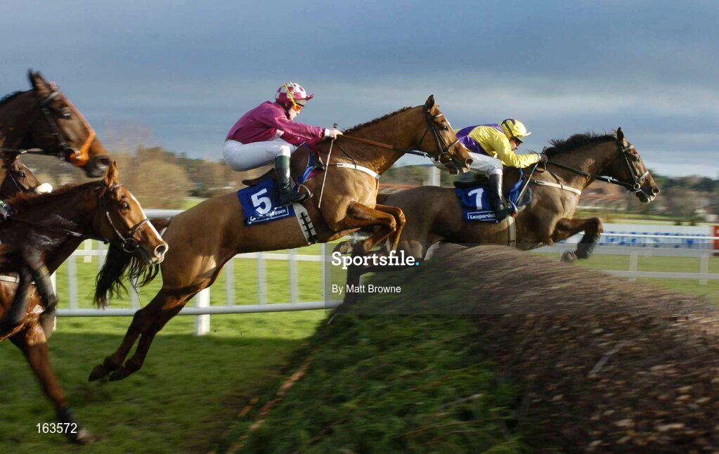 29 December 2004; Strong Project, 7,with Paul Carberry up, jumps the second ahead of Irish Stream, 5, with Paul Gallagher, on their way to winning the Coyle Hamilton Willis Beginners Steeplechase. Leopardstown Racecourse, Dublin. Picture credit; Matt Browne / SPORTSFILE