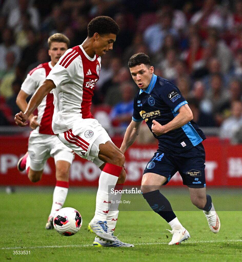 6 August 2026; Ali Coote of Shelbourne in action against Aaron Bouwman of Ajax during the UEFA Conference League Third Qualifying Round first leg match between Ajax and Shelbourne at Johan Cruyff Arena in Amsterdam, Netherlands. Photo by Seb Daly/Sportsfile