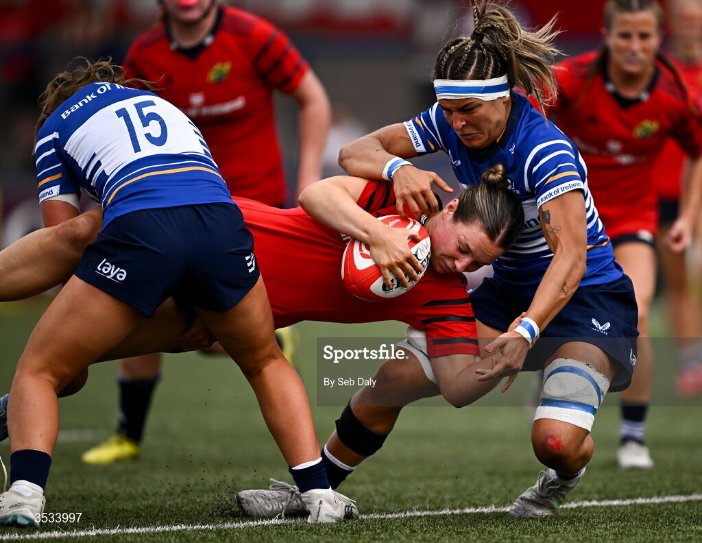 8 August 2026; Alana McInerney of Munster on her way to scoring her side's second try, despite the tackle of Leinster's Erin King, during the Vodafone Womens Interprovincial Championship Round 1 match between Munster and Leinster at Virgin Media Park in Cork. Photo by Seb Daly/Sportsfile
