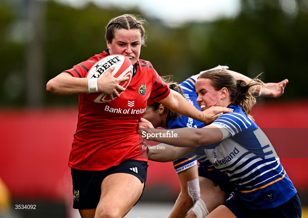 8 August 2026; Katie Corrigan of Munster holds of the challenge of Leinster's Robyn O'Connor on her way to scoring her side's sixth try during the Vodafone Womens Interprovincial Championship Round 1 match between Munster and Leinster at Virgin Media Park in Cork. Photo by Seb Daly/Sportsfile