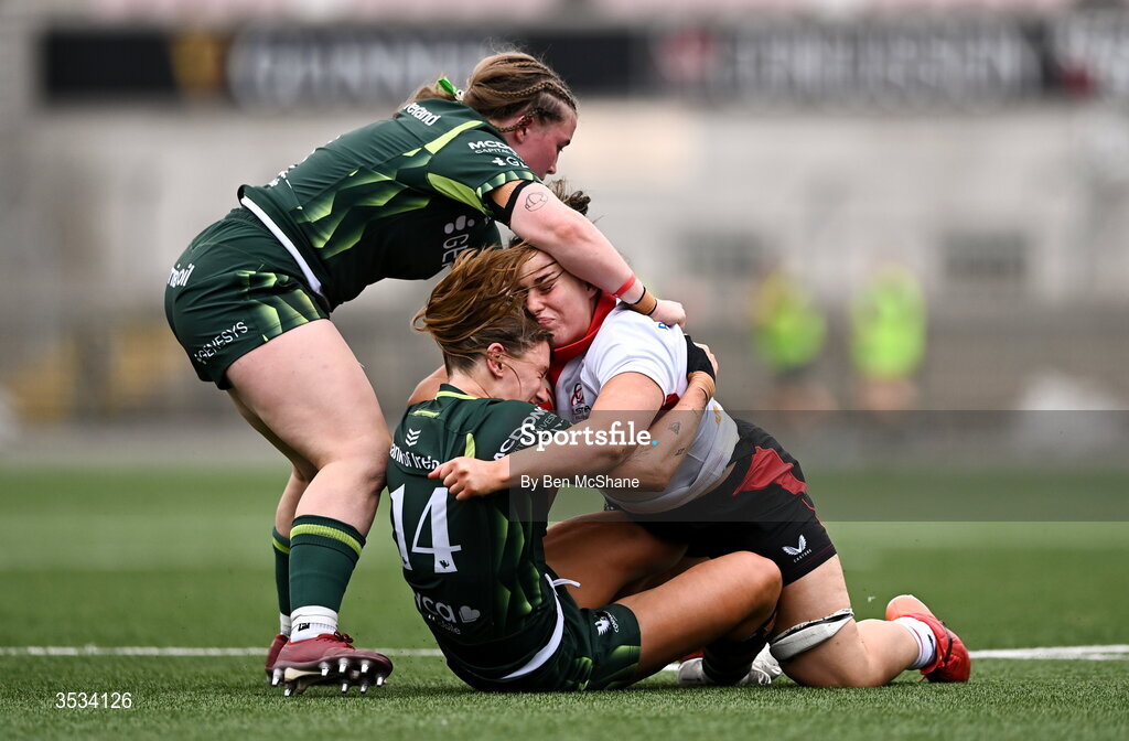 8 August 2026; Christy Hill of Ulster is tackled by Ella Burns, left, and Anna McGann of Connacht during the Vodafone Womens Interprovincial Championship Round 1 match between Ulster and Connacht at Affidea Stadium in Belfast. Photo by Ben McShane/Sportsfile