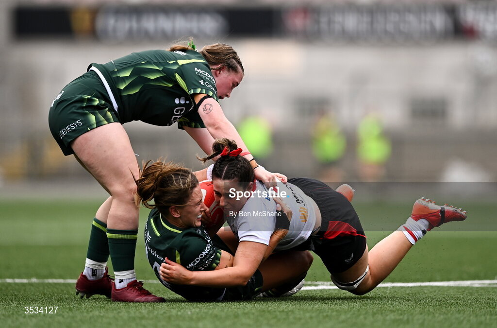 8 August 2026; Christy Hill of Ulster is tackled by Ella Burns, left, and Anna McGann of Connacht during the Vodafone Womens Interprovincial Championship Round 1 match between Ulster and Connacht at Affidea Stadium in Belfast. Photo by Ben McShane/Sportsfile