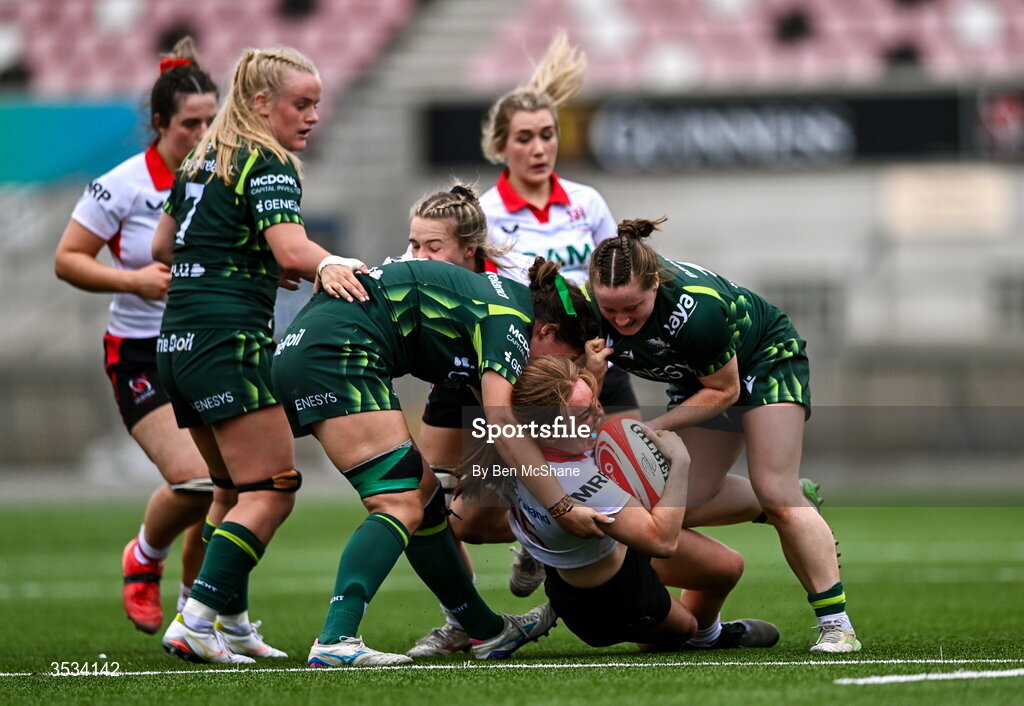 8 August 2026; Niamh Marley of Ulster is tackled by Jemima Adams Verling, left, and Meabh Deely of Connacht during the Vodafone Womens Interprovincial Championship Round 1 match between Ulster and Connacht at Affidea Stadium in Belfast. Photo by Ben McShane/Sportsfile